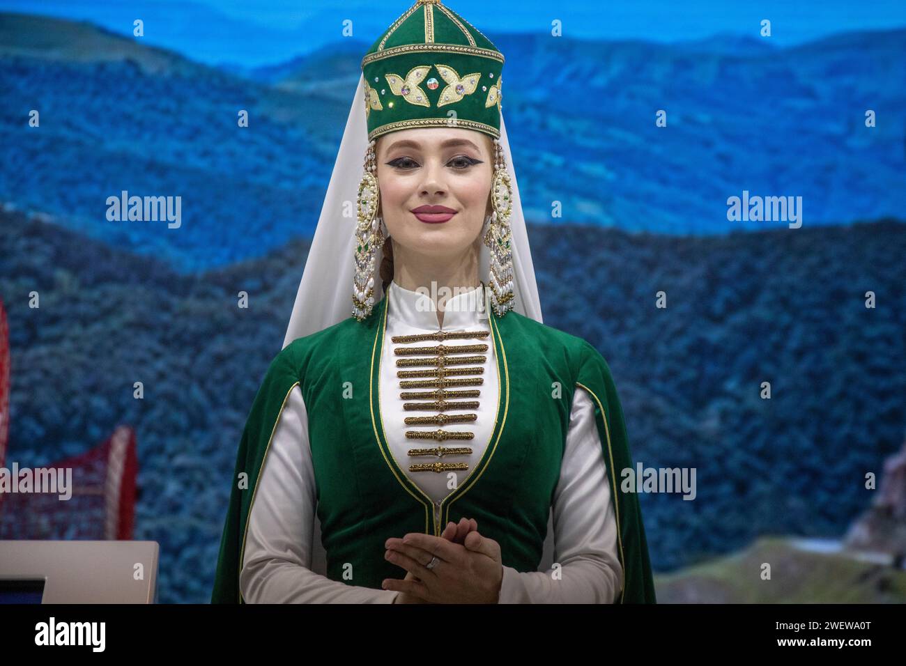 Moscow, Russia. 21st of January, 2024. A girl in a national costume at the stand of the Karachay-Cherkess Republic at the exhibition-forum 'Russia' at VDNH in Moscow, Russia Stock Photo