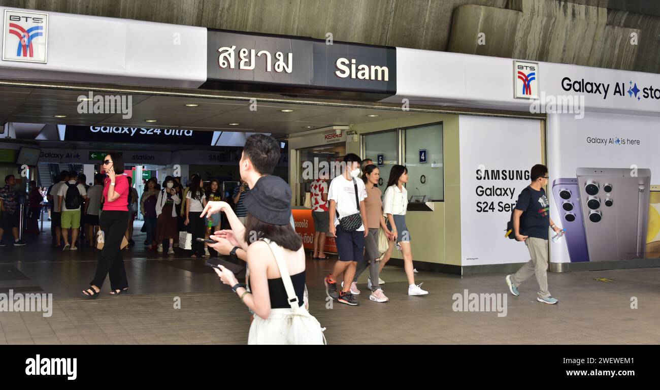 People At Entrance To Siam Bts Skytrain Station Next To Siam Mall Or People At Entrance To Siam Bts Skytrain Station Next To Siam Mall Or