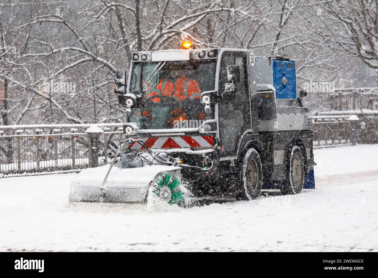 snowplow of the Cologne waste management company AWB at the cathedral, snow, winter, Cologne, Germany. January 17. 2024   Raeumfahrzeug der Abfallwirt Stock Photo