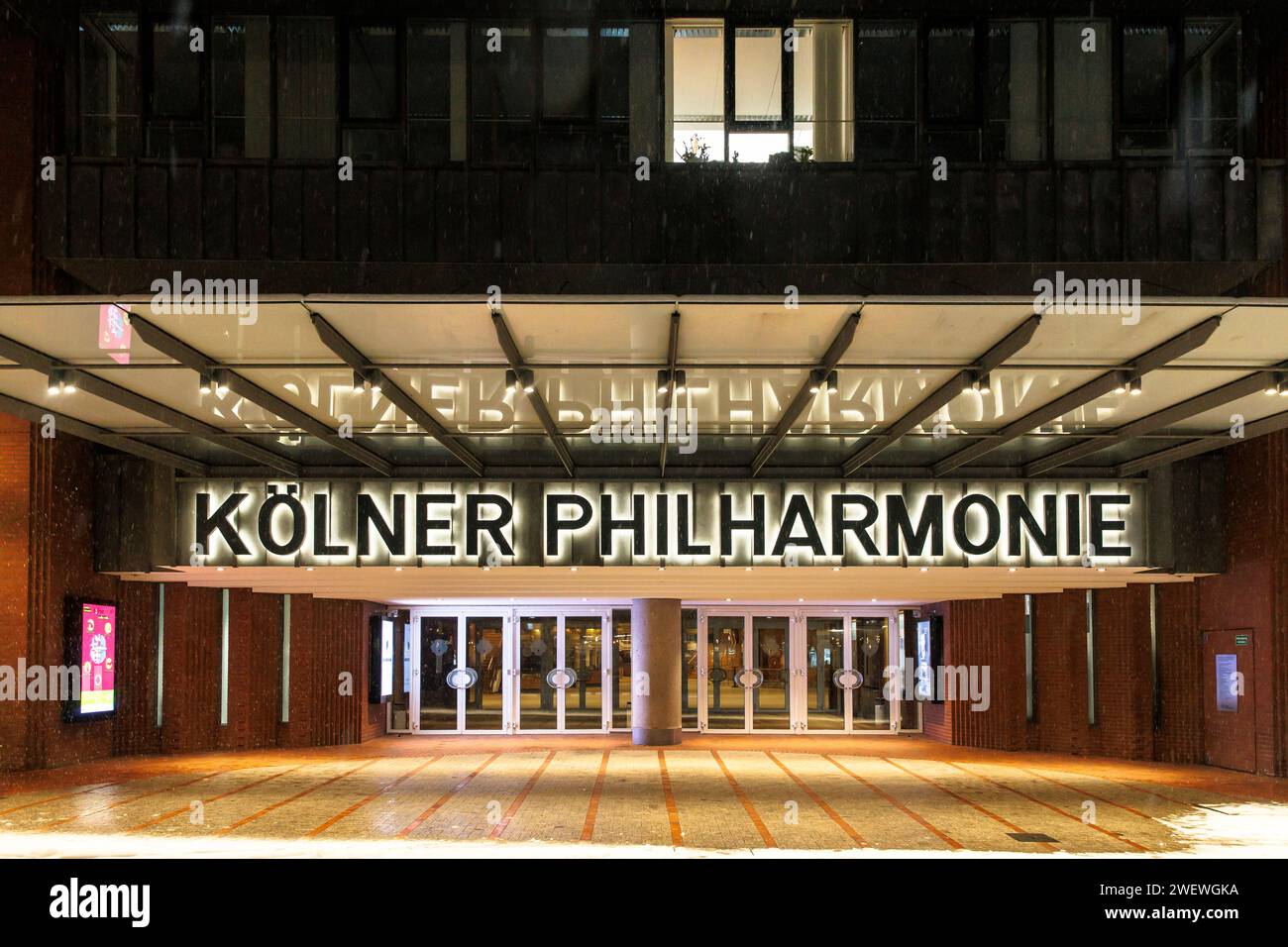 entrance to the Philharmonic Hall on Bischofgarten street, snowfall, Cologne, Germany. Eingang zur Koelner Philharmonie an der Bischofgartenstrasse, S Stock Photo