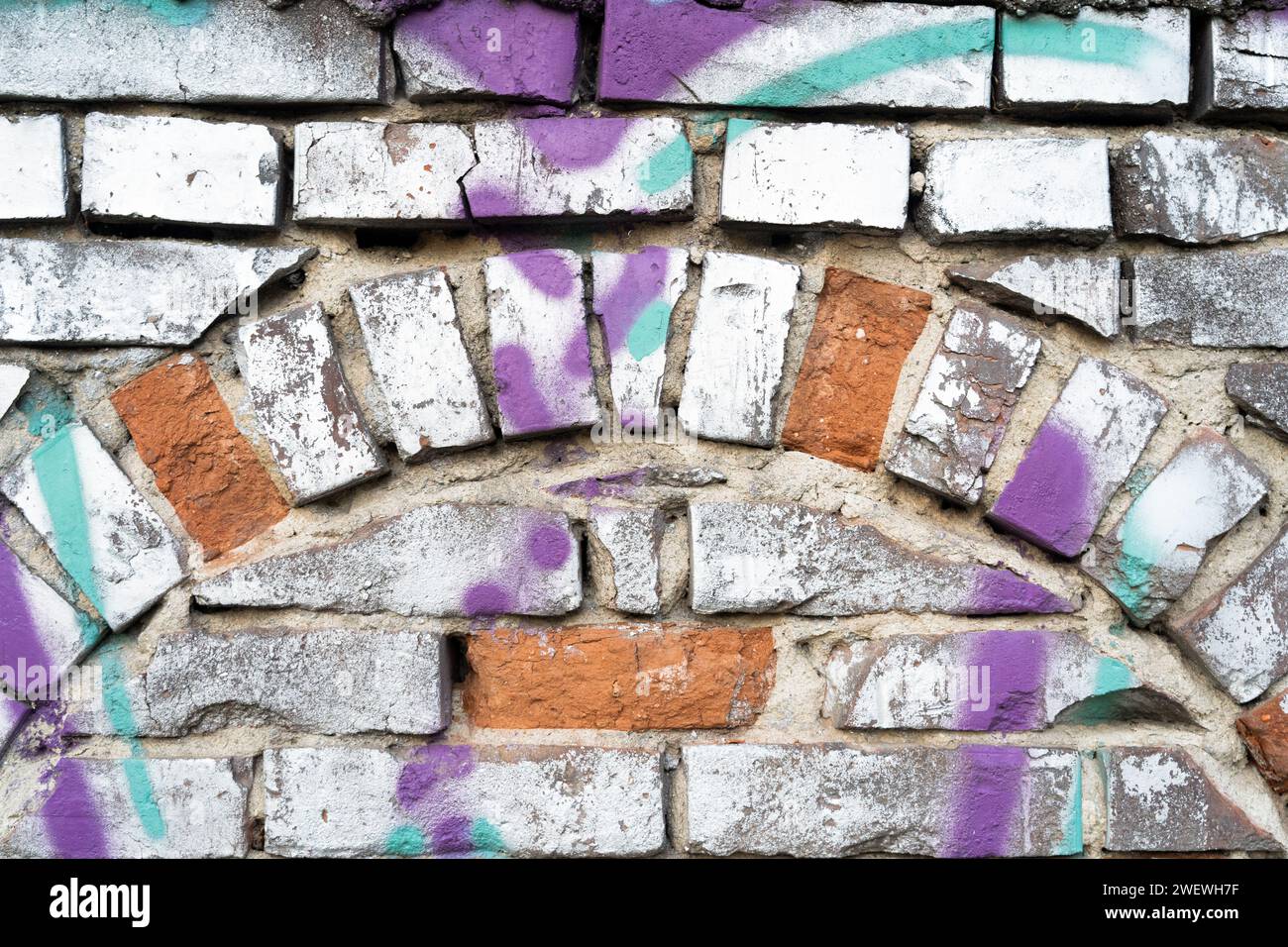 Colorful orange white purple paint on brick old wall background with half circle pattern that inspire equilibrium and joy Stock Photo