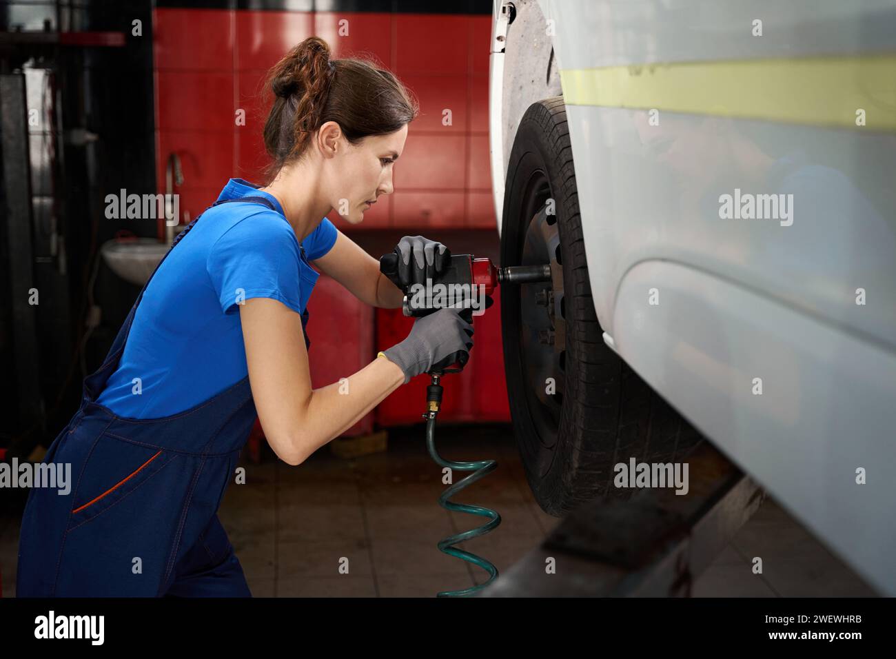 Mechanic uses pneumatic tool hi-res stock photography and images - Alamy