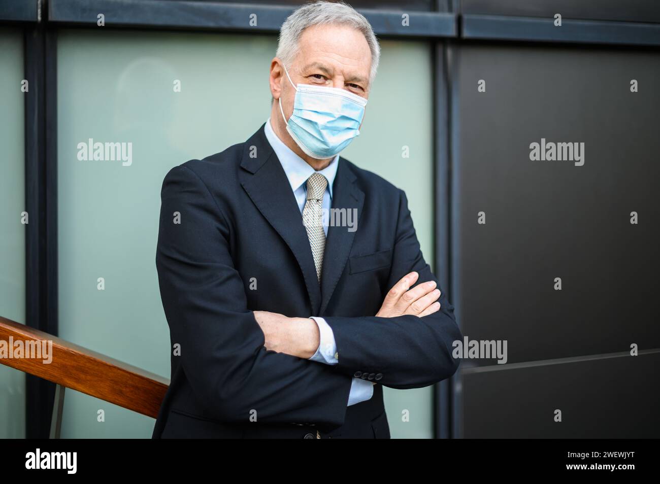 Mature professional stands arms hi-res stock photography and images - Alamy