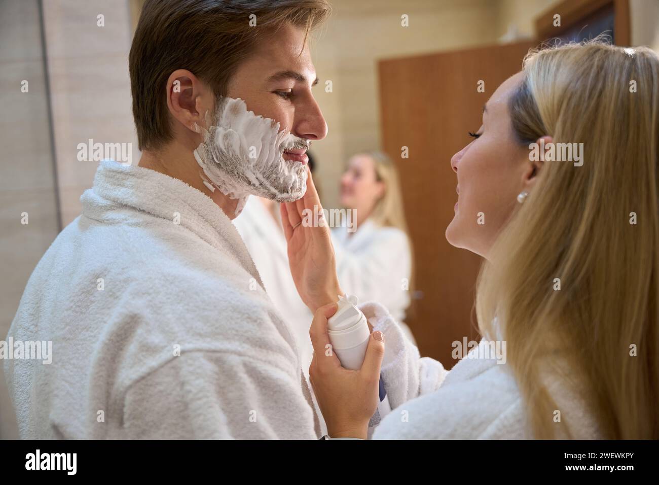 Joyful young woman applies hi-res stock photography and images - Alamy