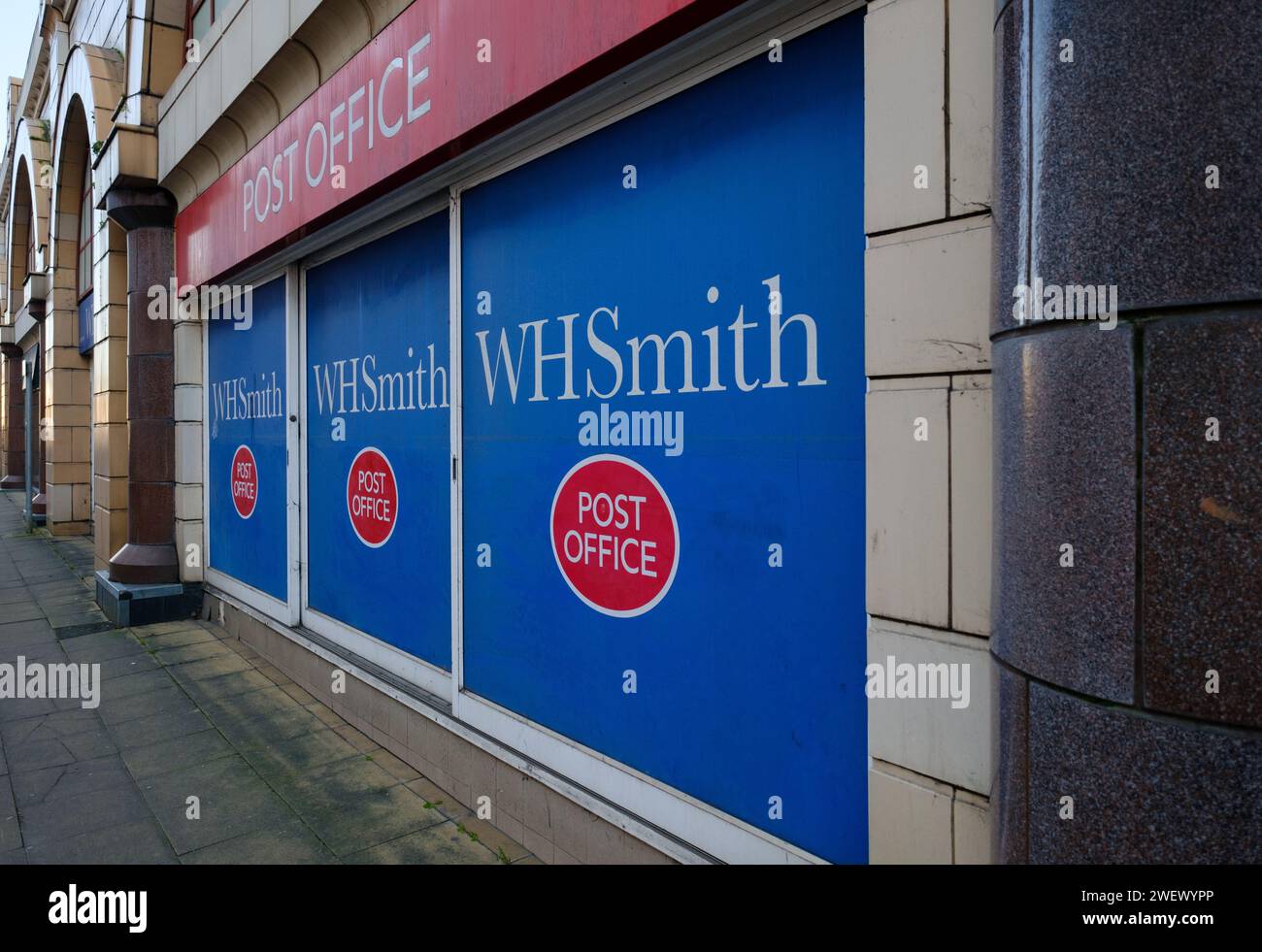 Shop Window of WHsmith in Redhill Surrey covered with the logo of the Post Office and WHsmith. Stock Photo