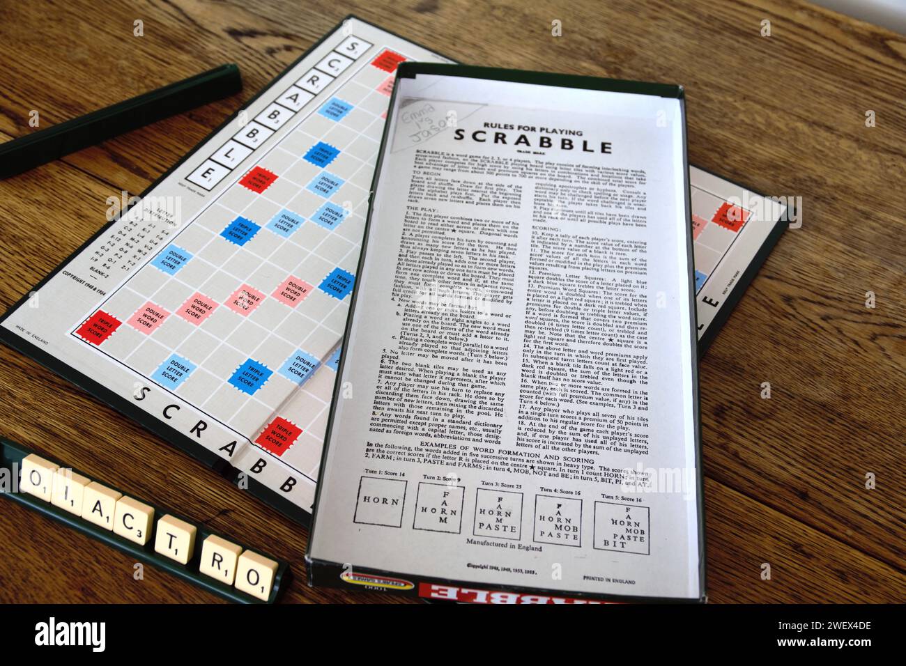 Scrabble board game. Spelling word play, making words out of tiles on square board to win points. Classic, retro family activity for adults and child Stock Photo