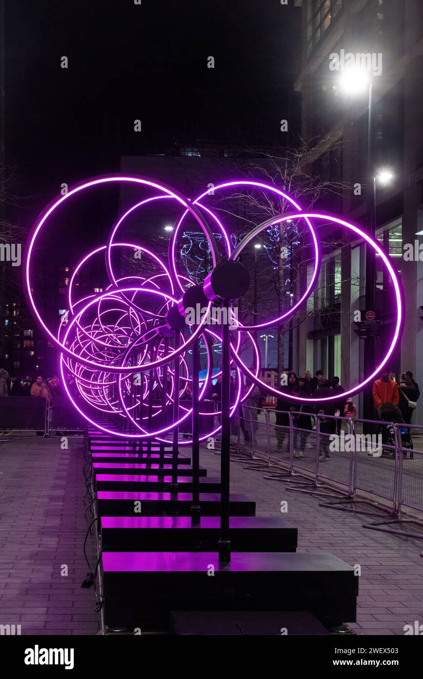 Canary Wharf Winter Lights, 26th January 2024, The popular annual Canary Wharf Winter Lights Festival is taking part in London from 17th to 27th January 2024, with 13 colourful light installations to see. Pictured: Kinetic Perspective by Juan Fuentes in Water Street Stock Photo