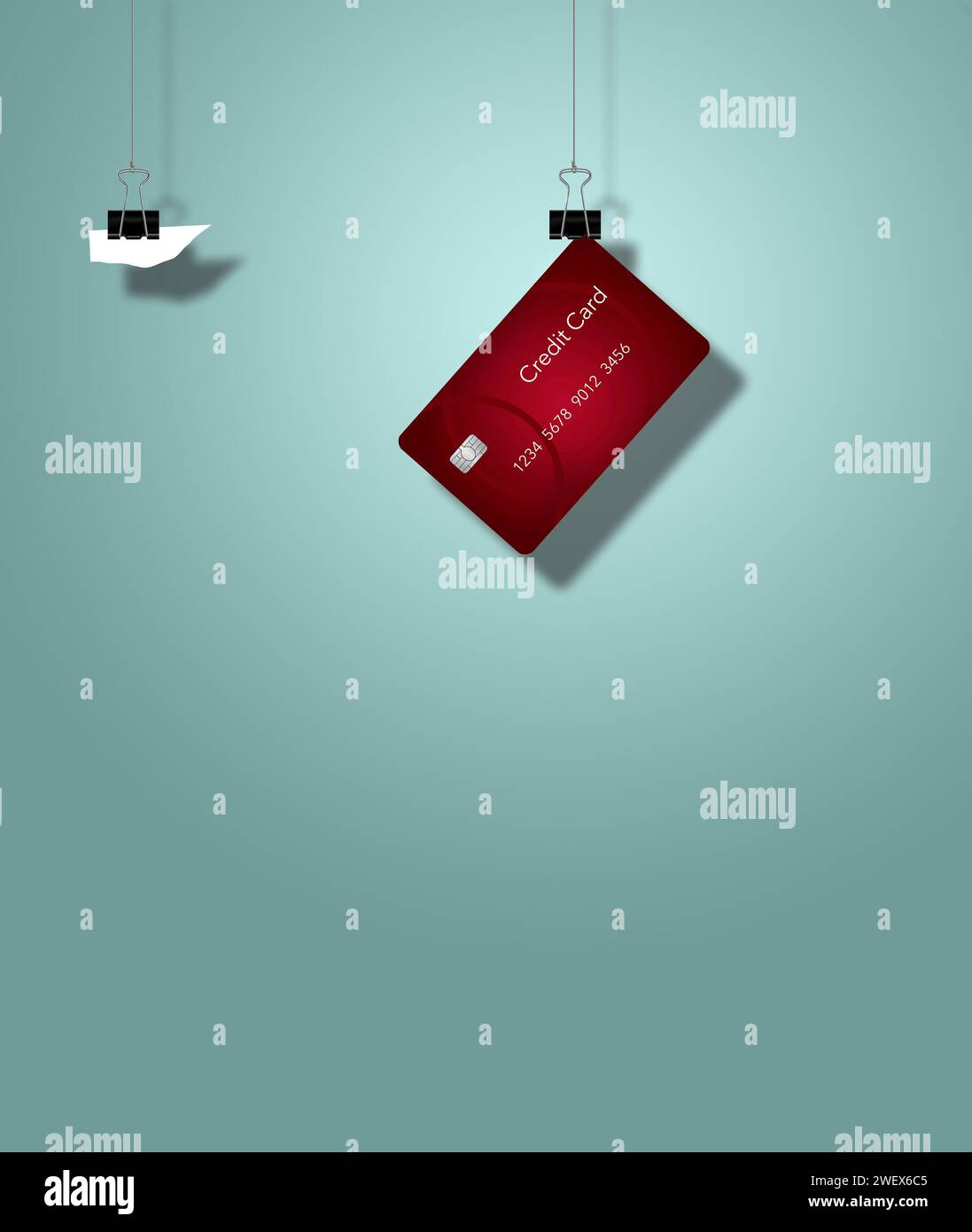 Back steel paper clamps hold a credit card and a scrap of paper in this 3-d illustration about credit cards. Copy space and text area available Stock Photo