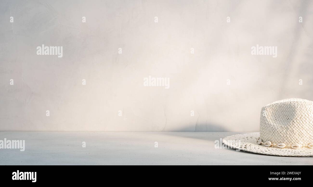 White Straw Hat Resting on a Table Against a Neutral Background With ...