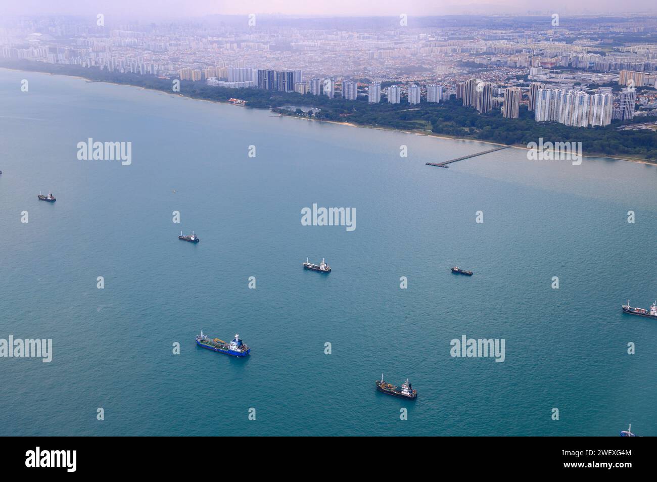 Aerial view of the Singapore Strait, Ocean liner, tanker and Cargo Ship in Singapore Strait, View from plane. Stock Photo