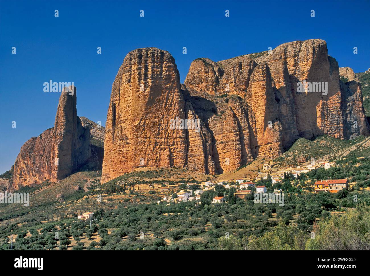 Town of Riglos at Los Mallos de Riglos rocks in Sierra de la Pena, Aragon, Spain Stock Photo