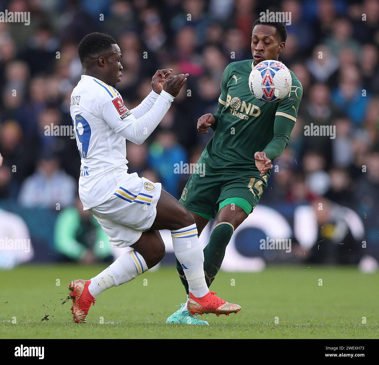 Leeds United's Wilfried Gnonto (left) and Plymouth Argyle's Mickel Miller battle for the ball during the Emirates FA Cup fourth round match at Elland Road, Leeds. Picture date: Saturday January 27, 2024. Stock Photo