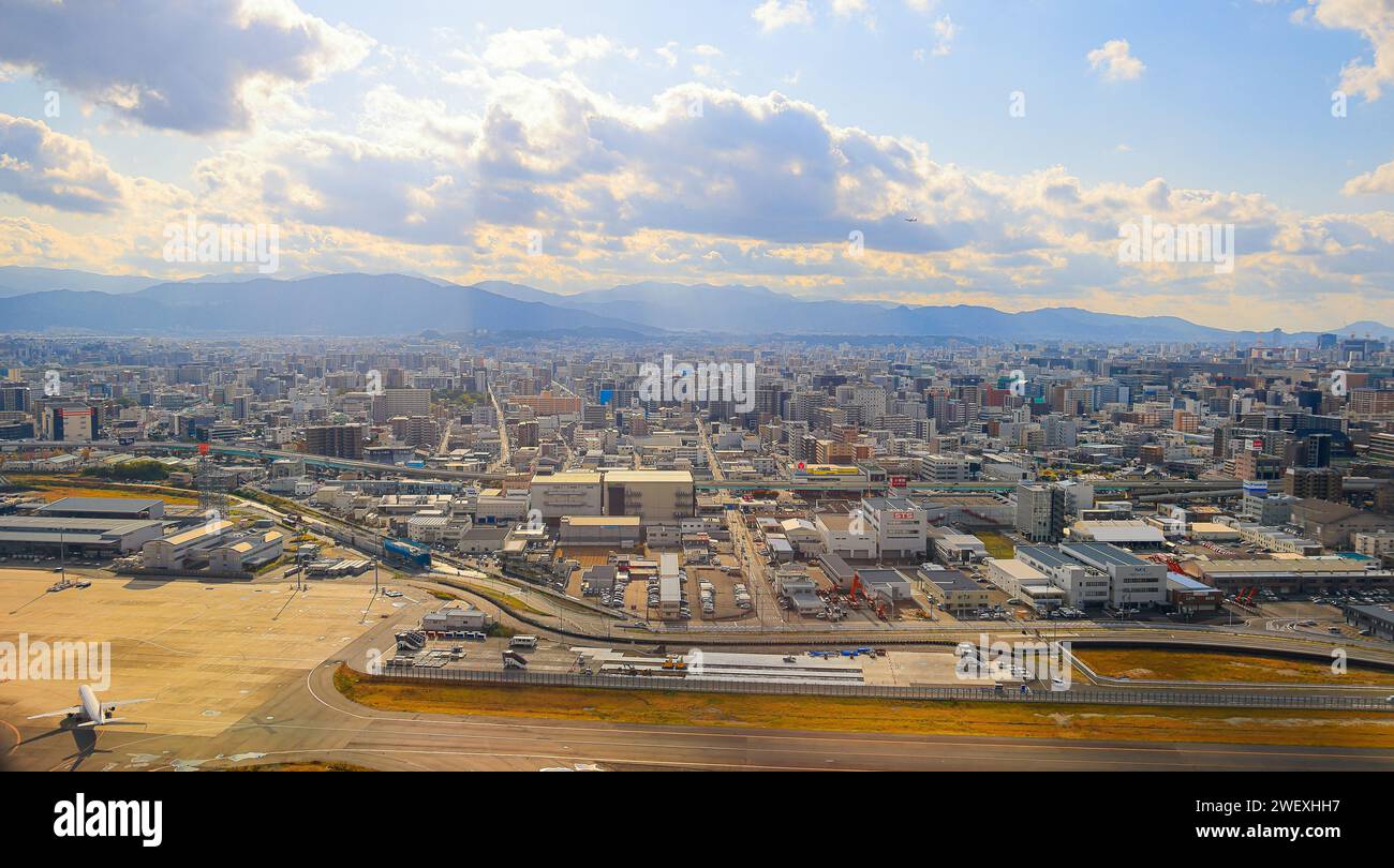 View of Fukuoka's CBD from above, taken in the hazy early hours of the morning, close to Fukuoka International Airport. Stock Photo
