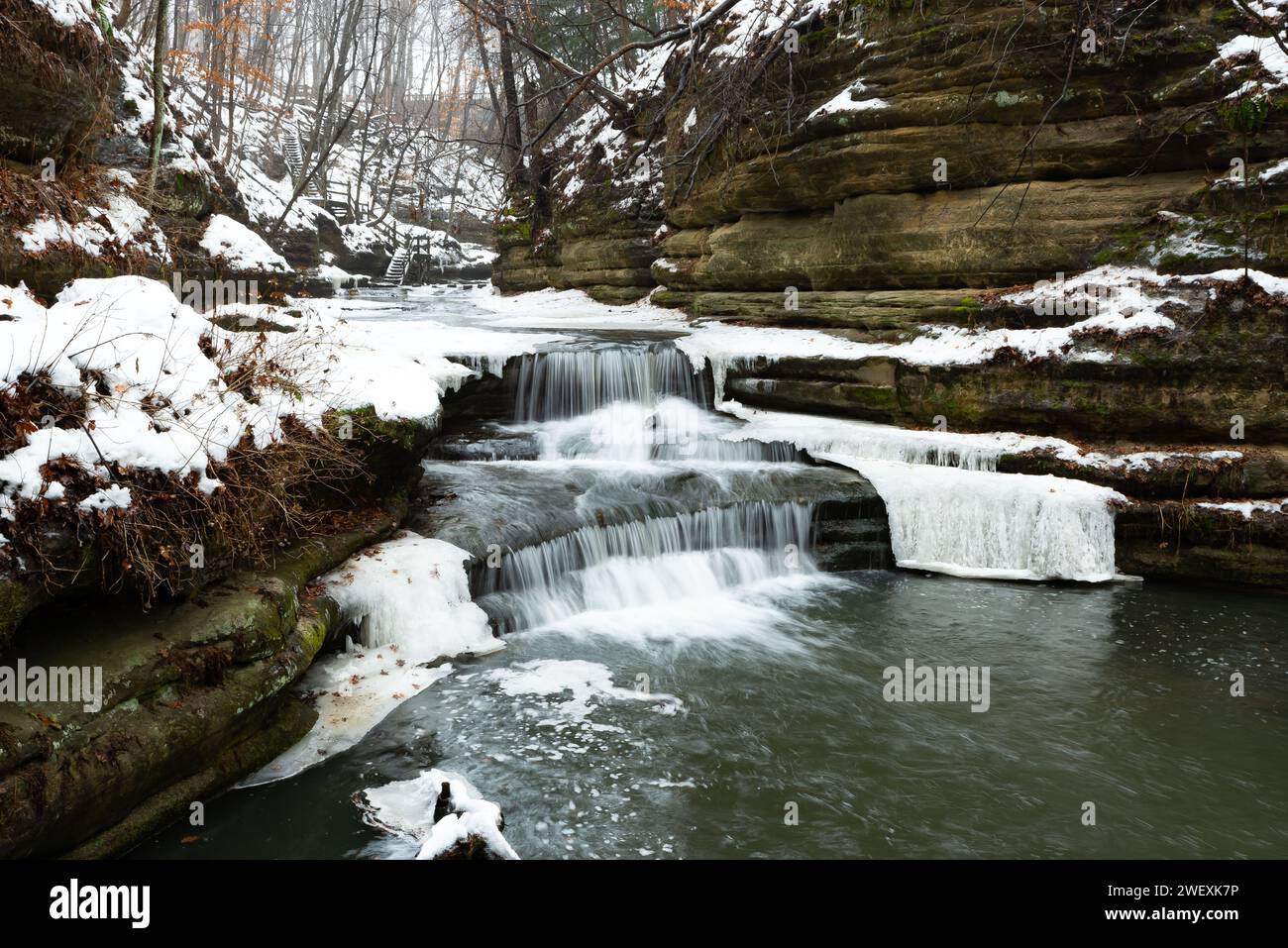 Water flowing down Giant's Bathtub as the snow melts at Matthiessen State Park, Illinois, USA. Stock Photo