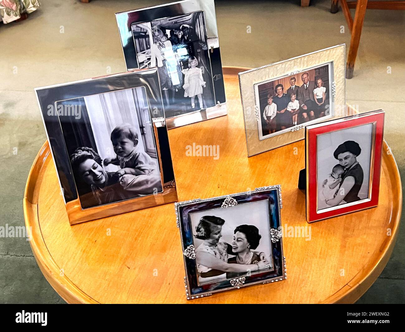 Framed Photos Arranged On A Table In Queen Elizabeth's Office Onboard Her Majesty's Yacht Britannia Stock Photo