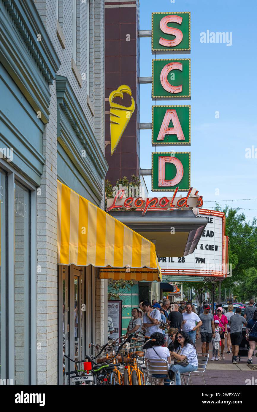 A long line for Leopold's Ice Cream forms beneath the SCAD (Savannah College of Art & Design) Trustee's Theater marquee in Downtown Savannah, Georgia. Stock Photo