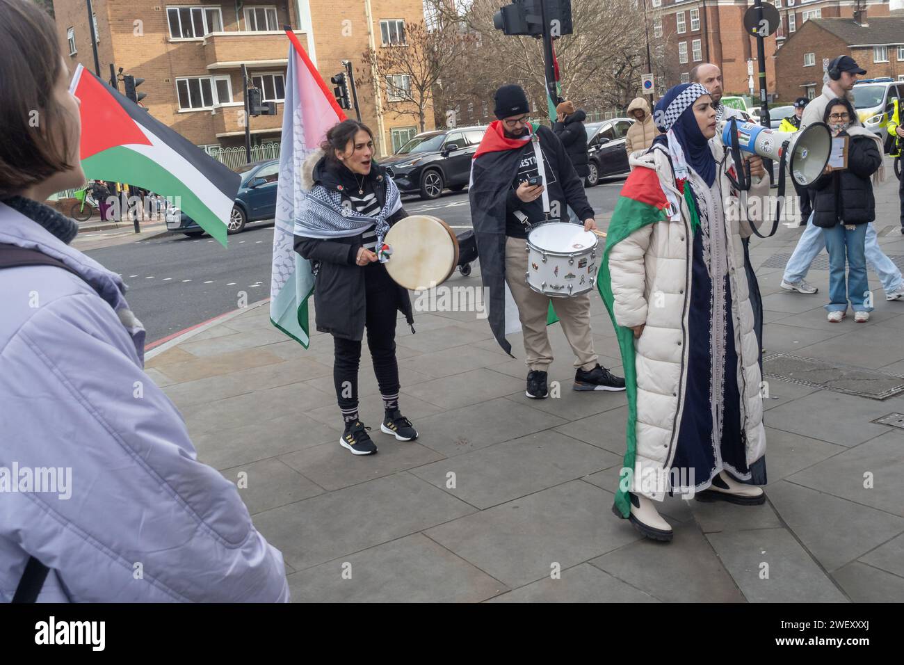 London, UK. 27 Jan 2024. People protest outside Barclay's Whitechapel