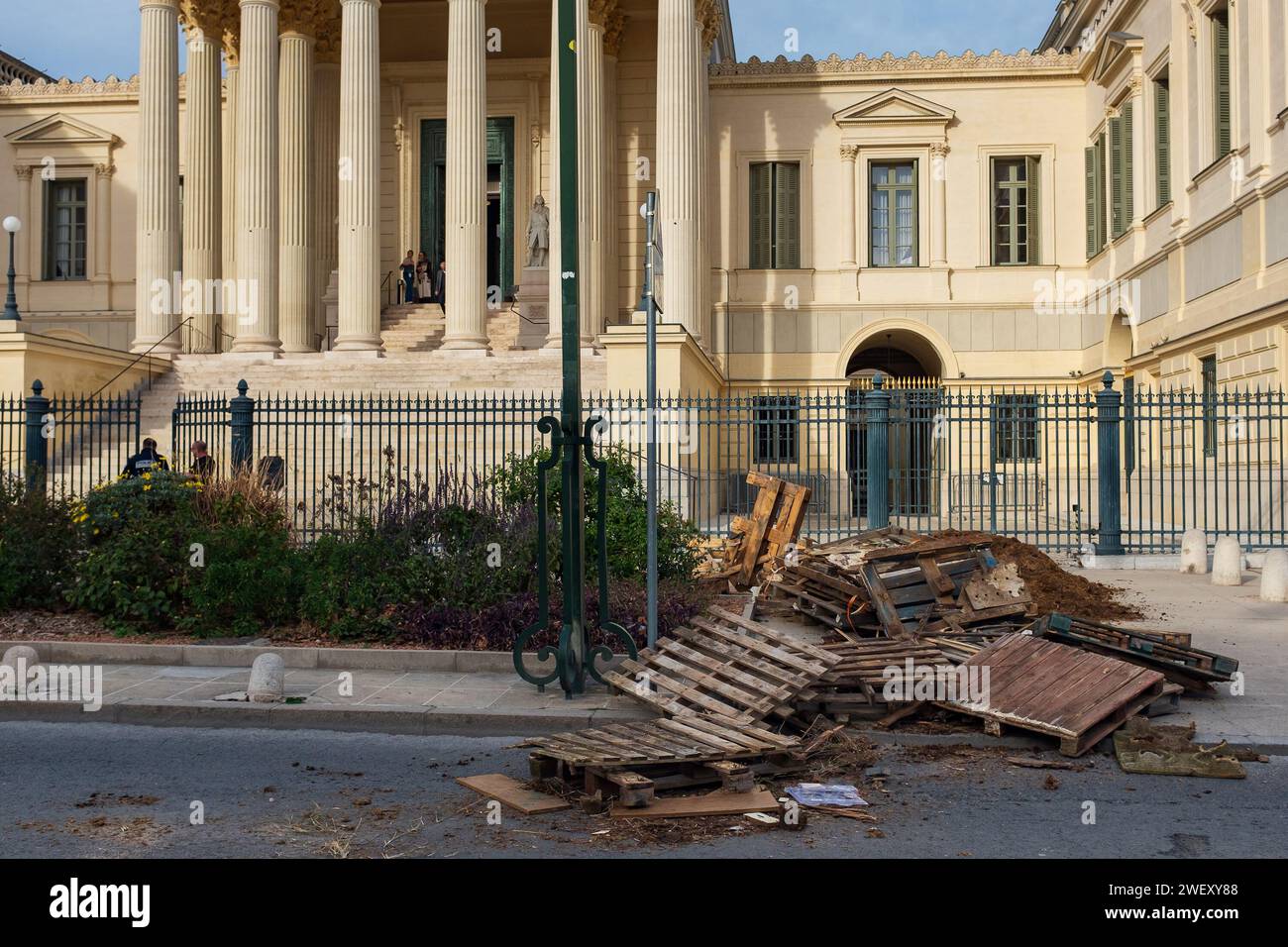 Montpellier, France, 2024. Wood pallets were stacked by farmers protesting falling incomes to block the rue Foch in front of the Court of Appeal Stock Photo