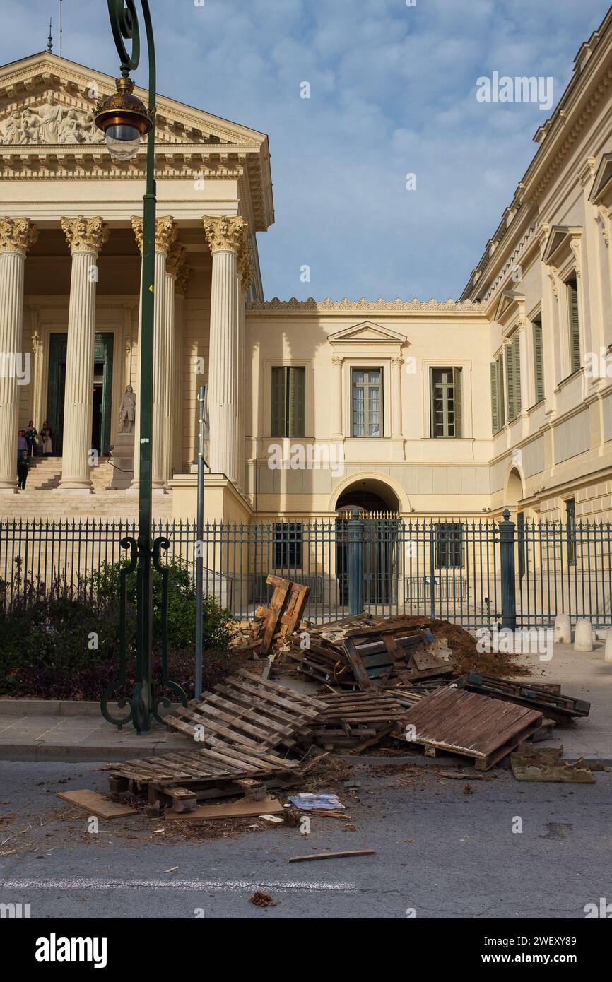 Montpellier, France, 2024. Pallets were stacked by farmers protesting falling incomes to block the rue Foch in front of the Court of Appeal (vertical) Stock Photo
