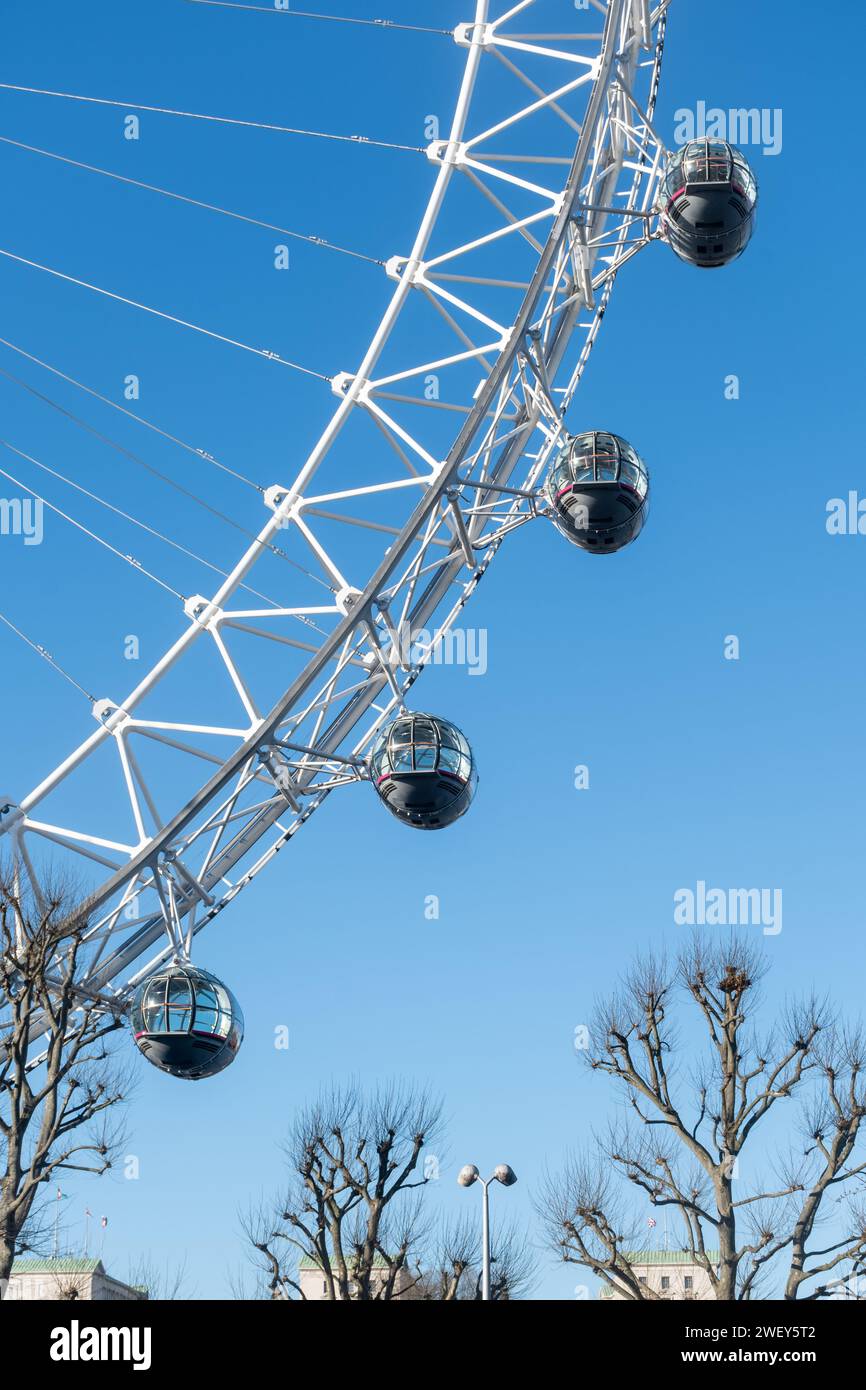 The London Eye, a popular tourist attraction in London, England, UK, against blue sky. Stock Photo