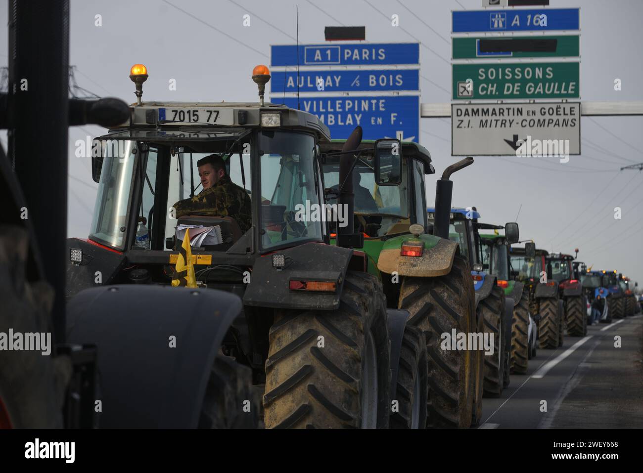 *** STRICTLY NO SALES TO FRENCH MEDIA OR PUBLISHERS - RIGHTS RESERVED ***January 27, 2024 - Mitry-Mory, France: French farmers from the Coordination Rurale union drive their tractors in protest towards Paris CDG airport, amid threats to block traffic around the French capital. Farmers angered over low remuneration, red tape, and unfair imports have vowed to continue protesting, maintaining traffic barricades on motorways, a day after the government's series of pro-agriculture measures. Stock Photo