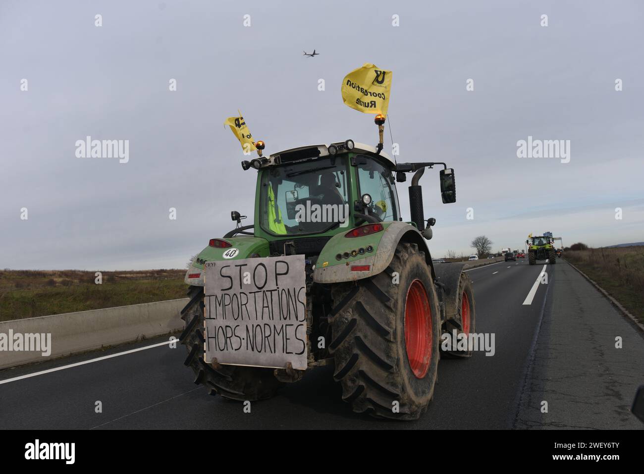 *** STRICTLY NO SALES TO FRENCH MEDIA OR PUBLISHERS - RIGHTS RESERVED ***January 27, 2024 - Mitry-Mory, France: French farmers from the Coordination Rurale union drive their tractors in protest towards Paris CDG airport, amid threats to block traffic around the French capital. Farmers angered over low remuneration, red tape, and unfair imports have vowed to continue protesting, maintaining traffic barricades on motorways, a day after the government's series of pro-agriculture measures. Stock Photo