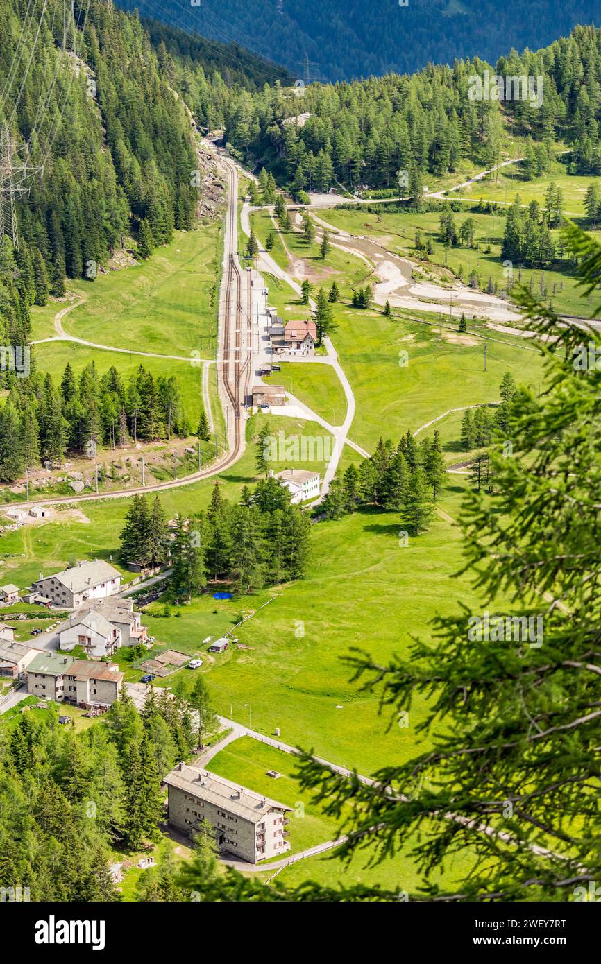 High angle train station. Swiss Alps scenery green view. Travel in Switzerland during the spring. Stock Photo