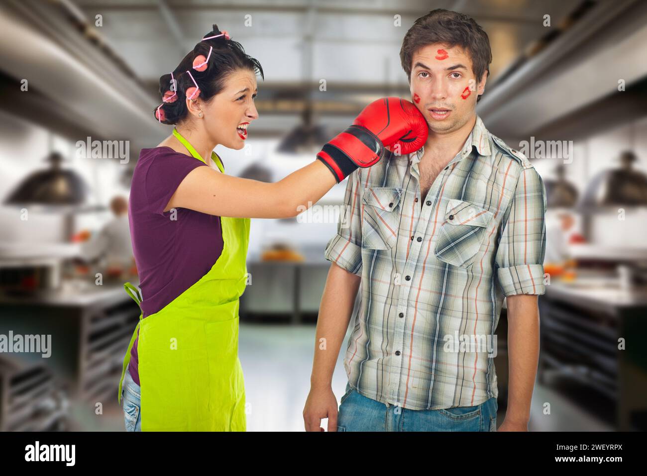 "In a playful moment, a woman reacts with humor as she playfully hits