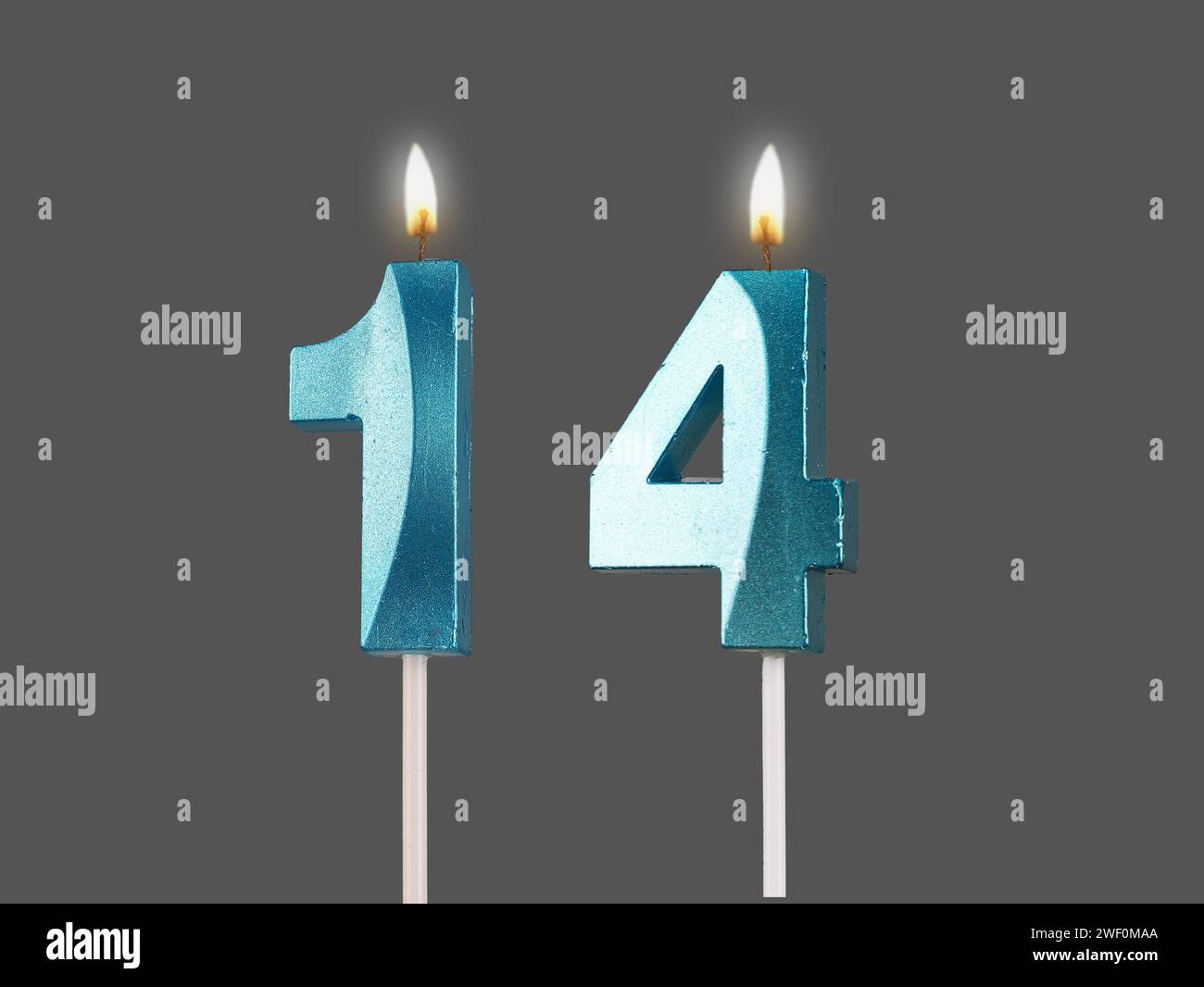 14-birthday-number-candles-with-light-isolated-on-white-background