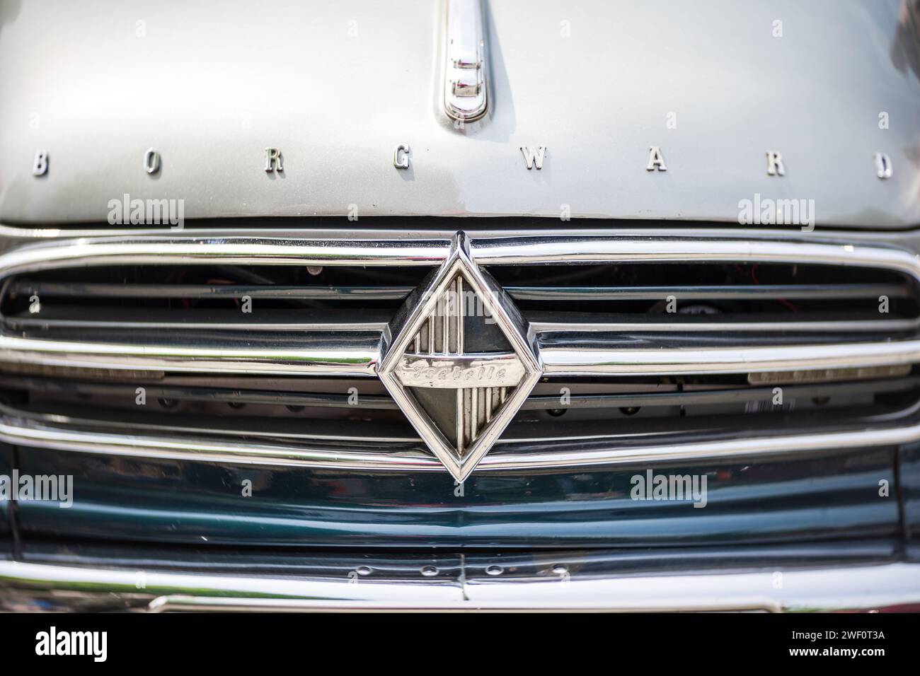 WERDER (HAVEL), GERMANY - MAY 20, 2023: The front emblem of mid-size car Borgward Isabella. Swirl bokeh. Art lens. Festival Werder Classics 2023 Stock Photo
