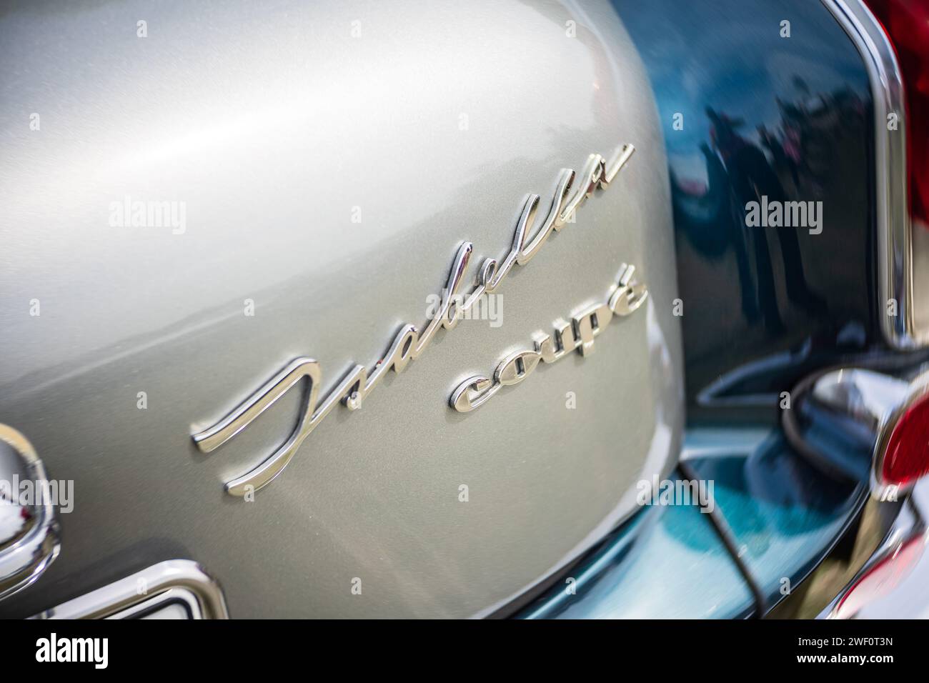WERDER (HAVEL), GERMANY - MAY 20, 2023: The rear emblem of mid-size car Borgward Isabella Coupe. Swirl bokeh. Art lens. Festival Werder Classics 2023 Stock Photo