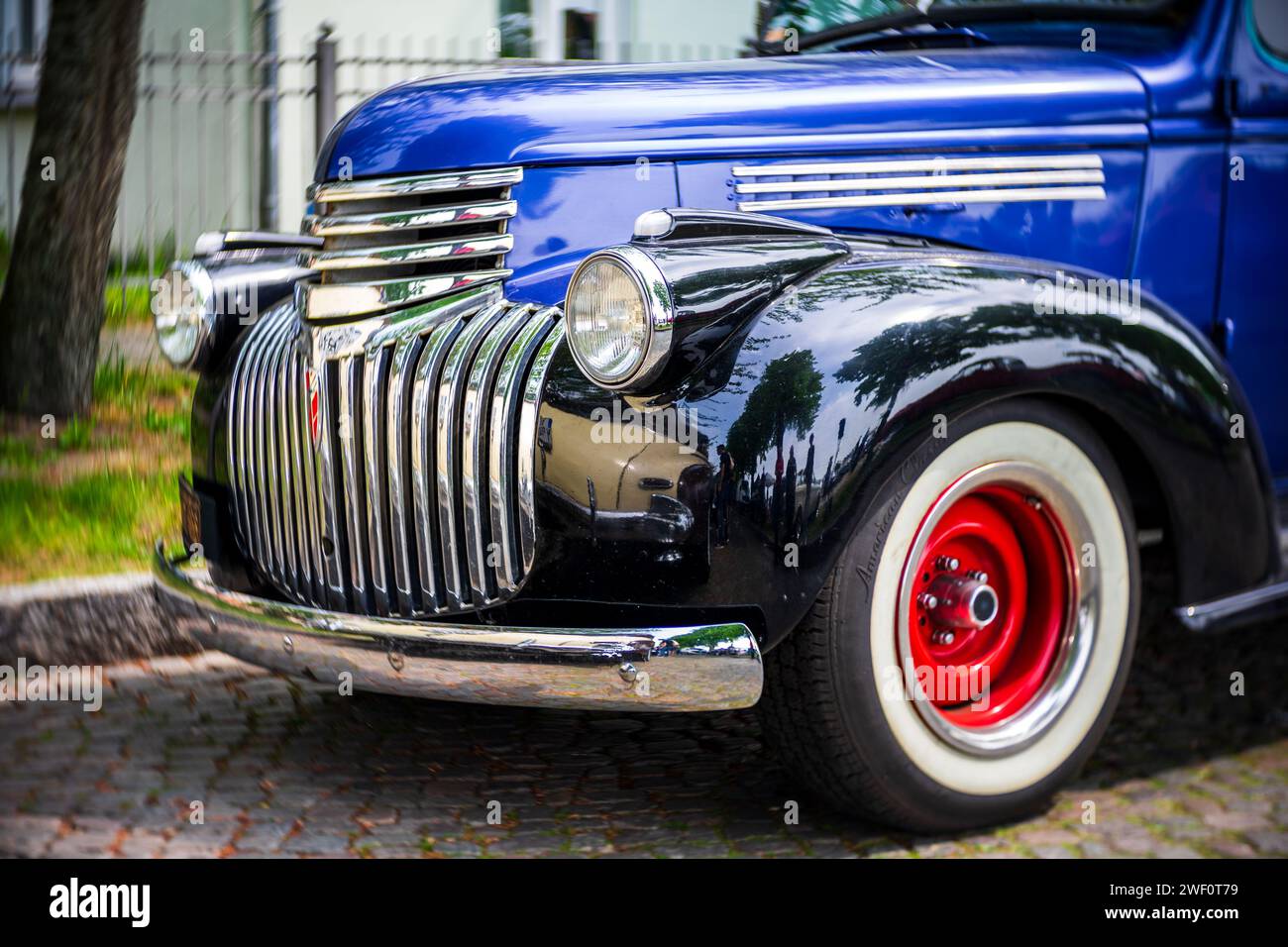 WERDER (HAVEL), GERMANY - MAY 20, 2023: The fragment of a full-size station wagon Chevrolet Carryall Suburban, 1941. Swirl bokeh. Art lens. Stock Photo