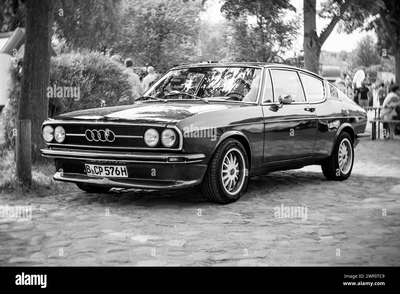 WERDER (HAVEL), GERMANY - MAY 20, 2023: The mid-size car Audi 100 Coupe S, 1976. Swirl bokeh, art lens.  Festival Werder Classics 2023 Stock Photo