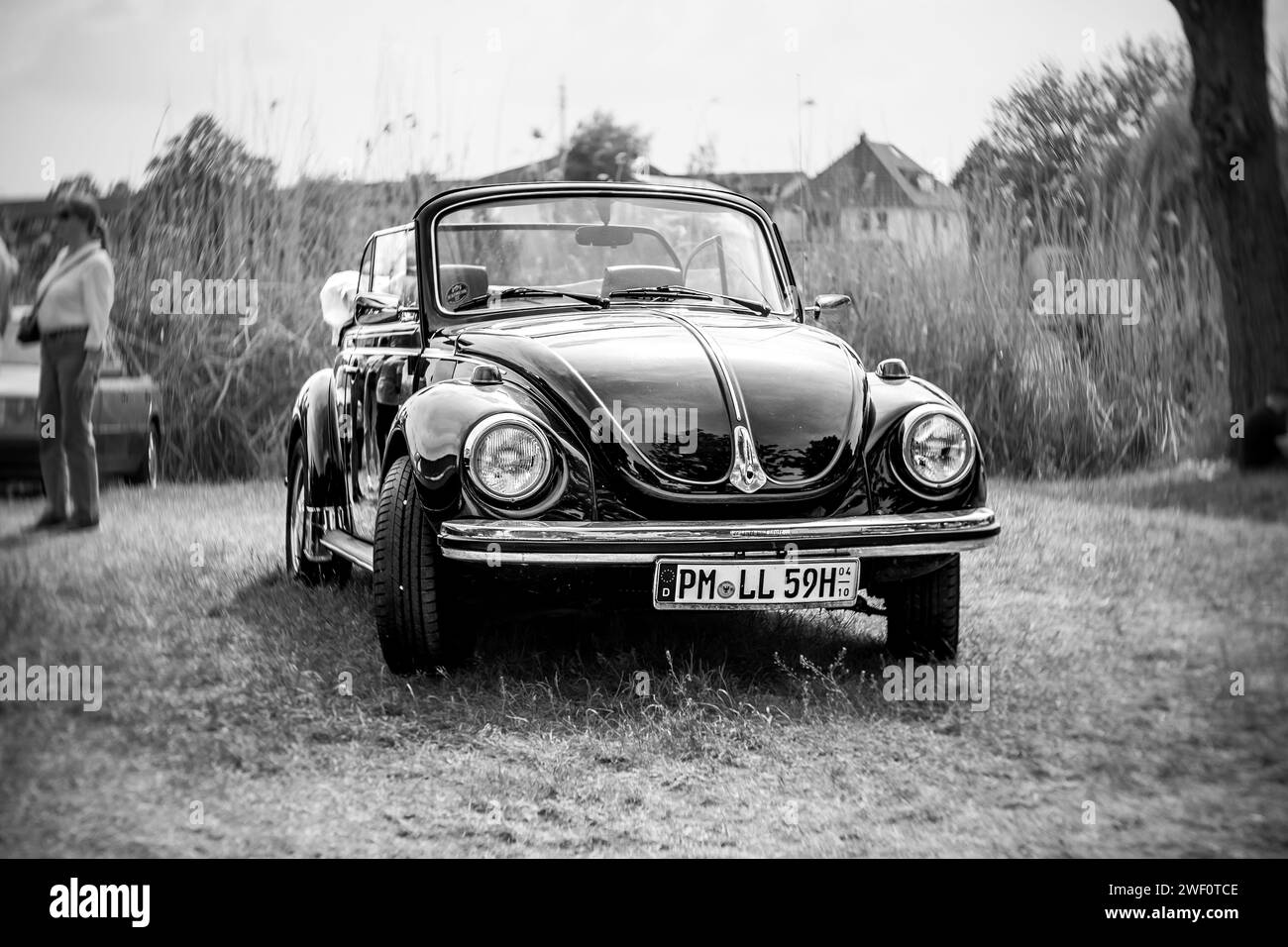 WERDER (HAVEL), GERMANY - MAY 20, 2023: The subcompact, economy car Volkswagen Beetle Convertible. Swirl bokeh, art lens. Black and white. Stock Photo