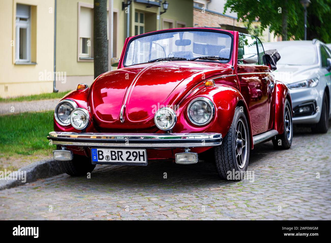 WERDER (HAVEL), GERMANY - MAY 20, 2023: The subcompact, economy car Volkswagen Beetle Convertible. Swirl bokeh, art lens.  Festival Werder Classics Stock Photo
