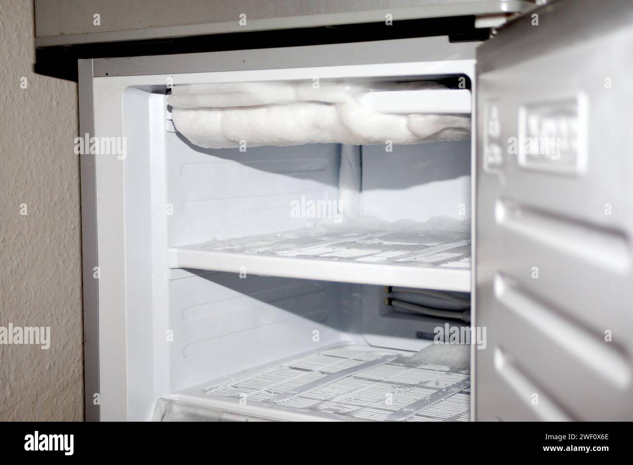 defrost refrigerator. melting ice in fridge Stock Photo