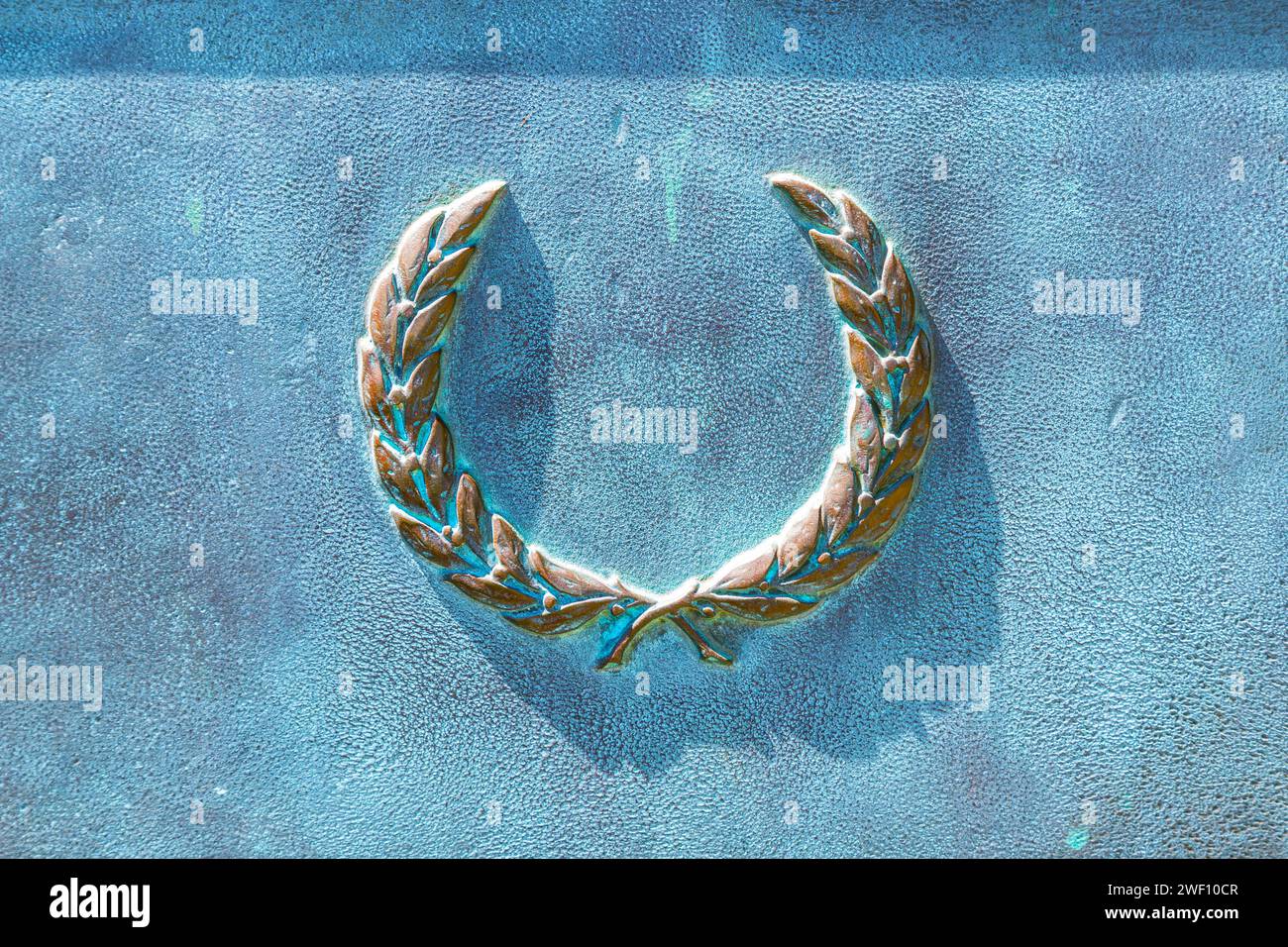 Bronze wreath, detail of the monument, close-up. Background is a bronze ...