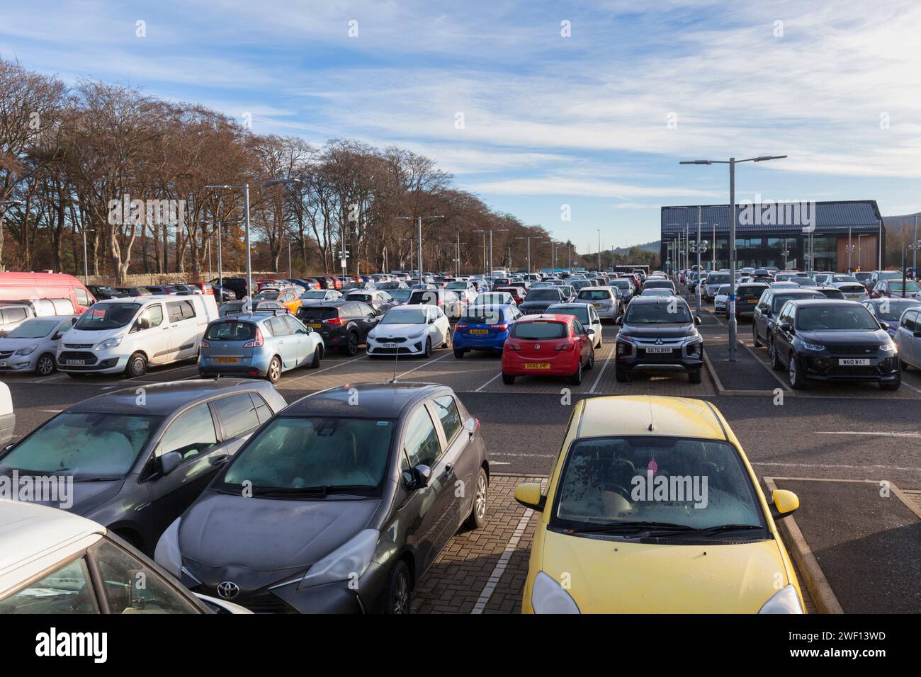 Cars in the car park at the park and ride railway station at Tweedbank at the end of the