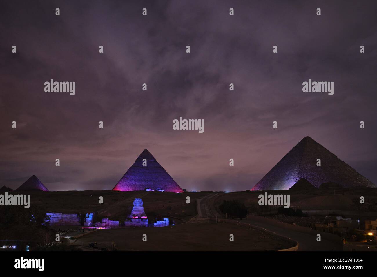 Giza, Egypt - December 24 2023: Colourful light shows on ancient Giza Pyramids Stock Photo