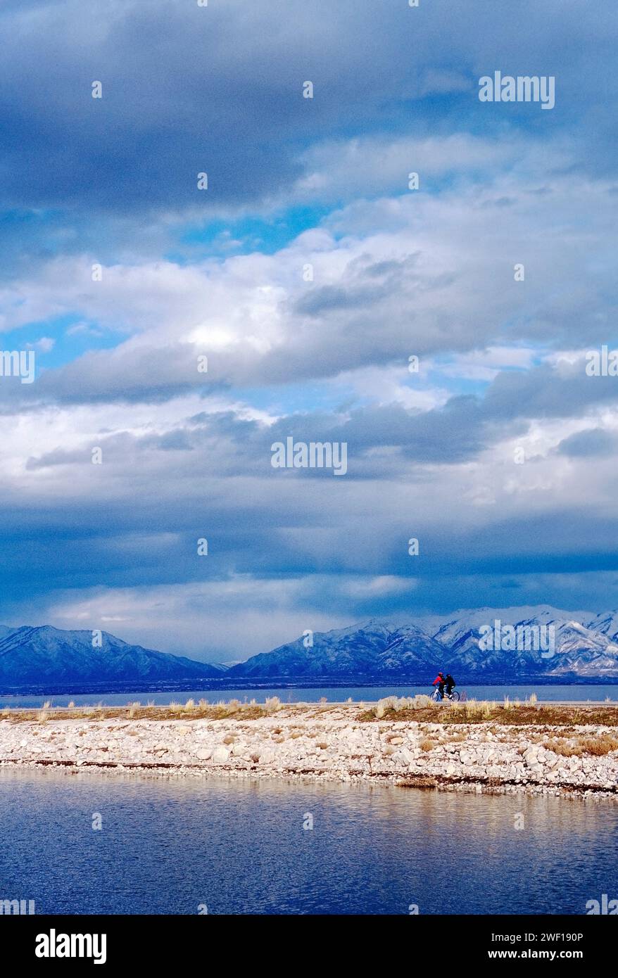 Tandem cyclists on access road across Great Salt Lake to Antelope