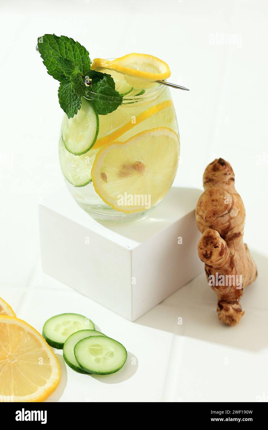Sashi Healthy Slimming Water. Fresh Cold Water with Sliced Lemon, Cucumber, Ginger, Mint Leaf, and Ice in a Glass Stock Photo