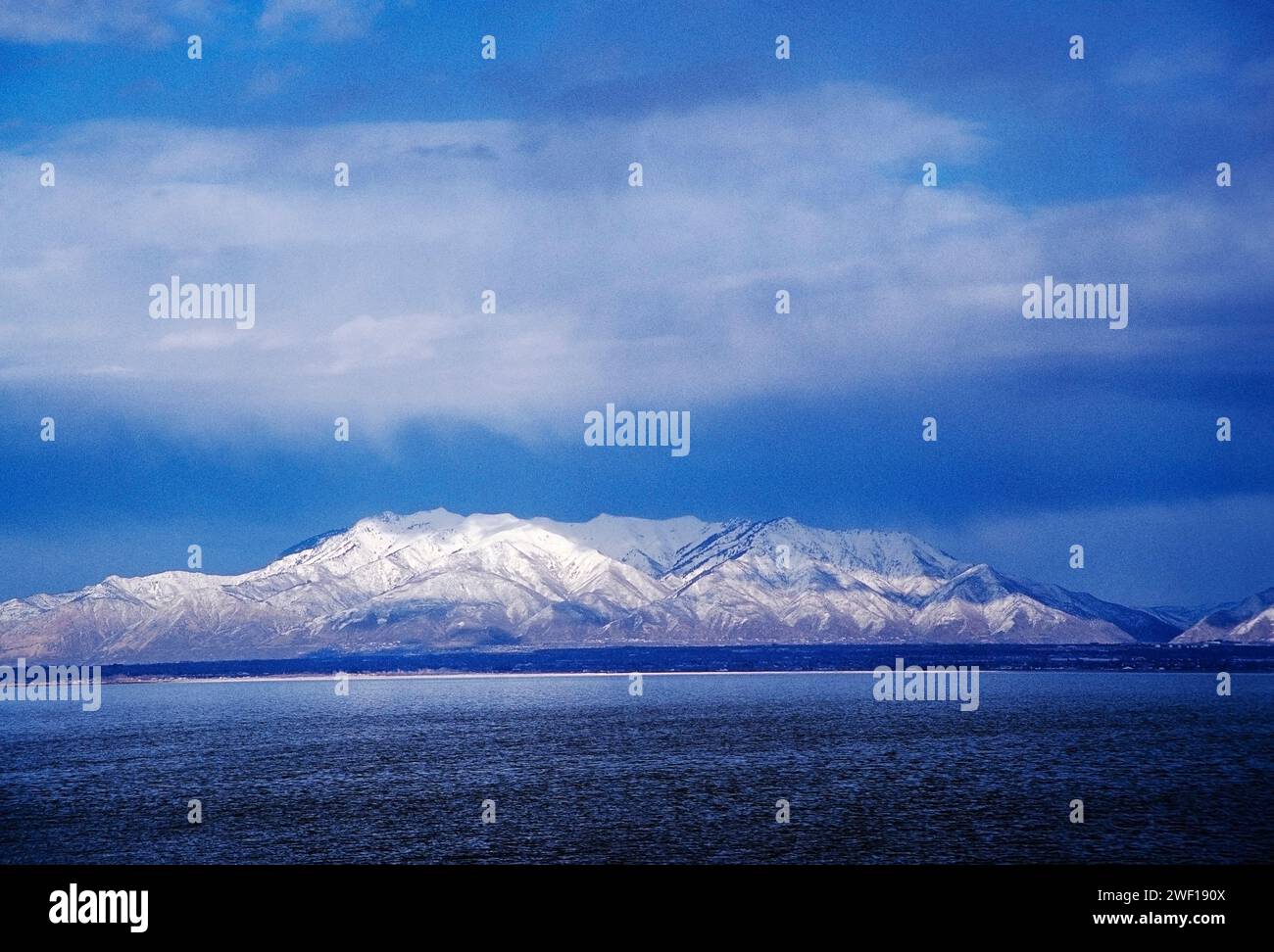 Snow capped peaks of Wasatch Range; view from Antelope Island State Park; Salt Lake City; Utah; USA Stock Photo