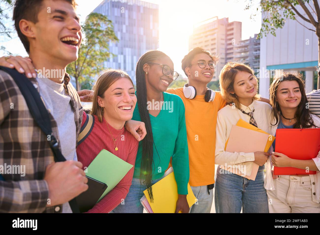Happy young multiracial university students posing together taking a photo Stock Photo