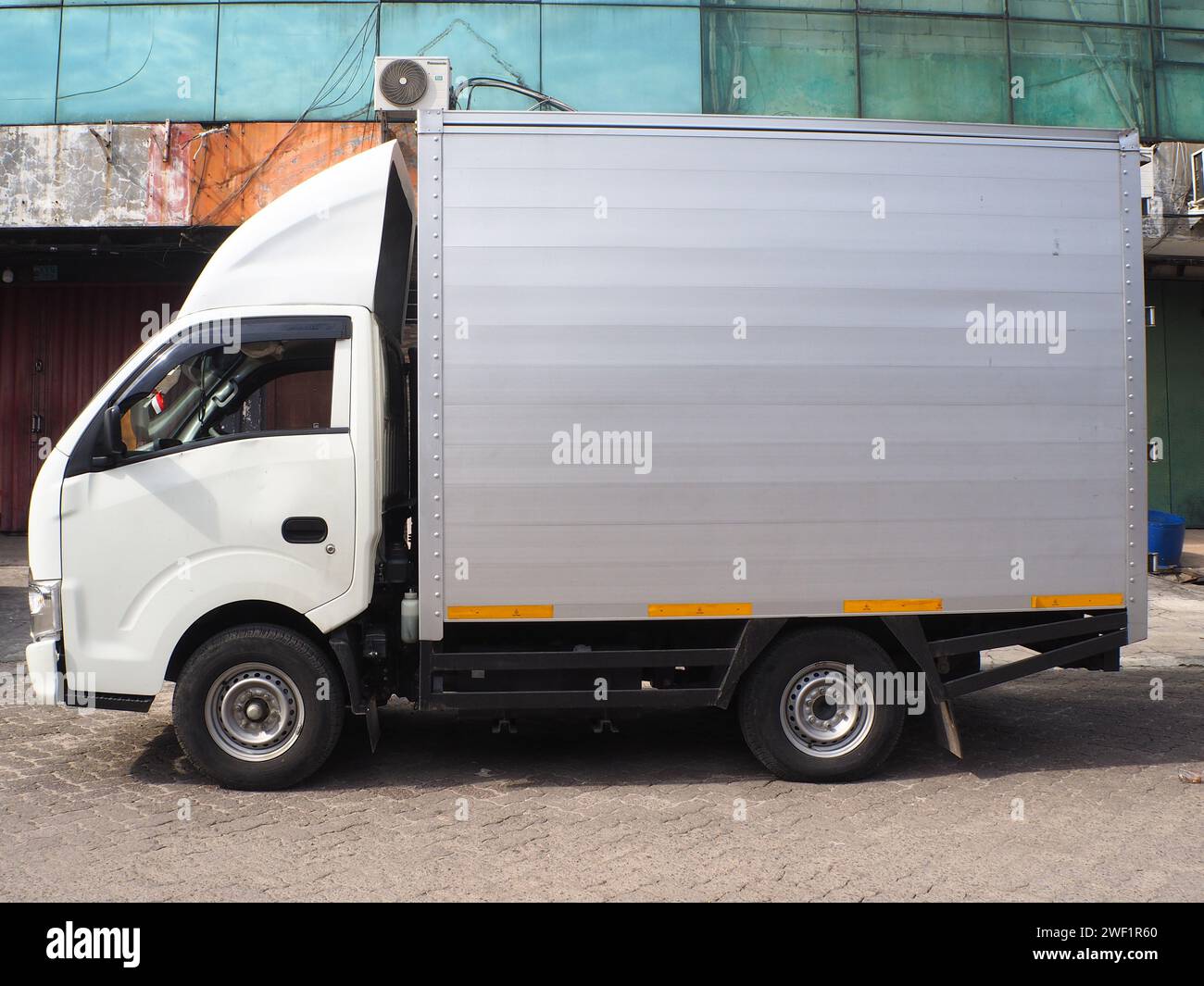 Car Isuzu Traga Box Aluminium for goods and logistic with manual transmission, it runs on diesel engine Stock Photo