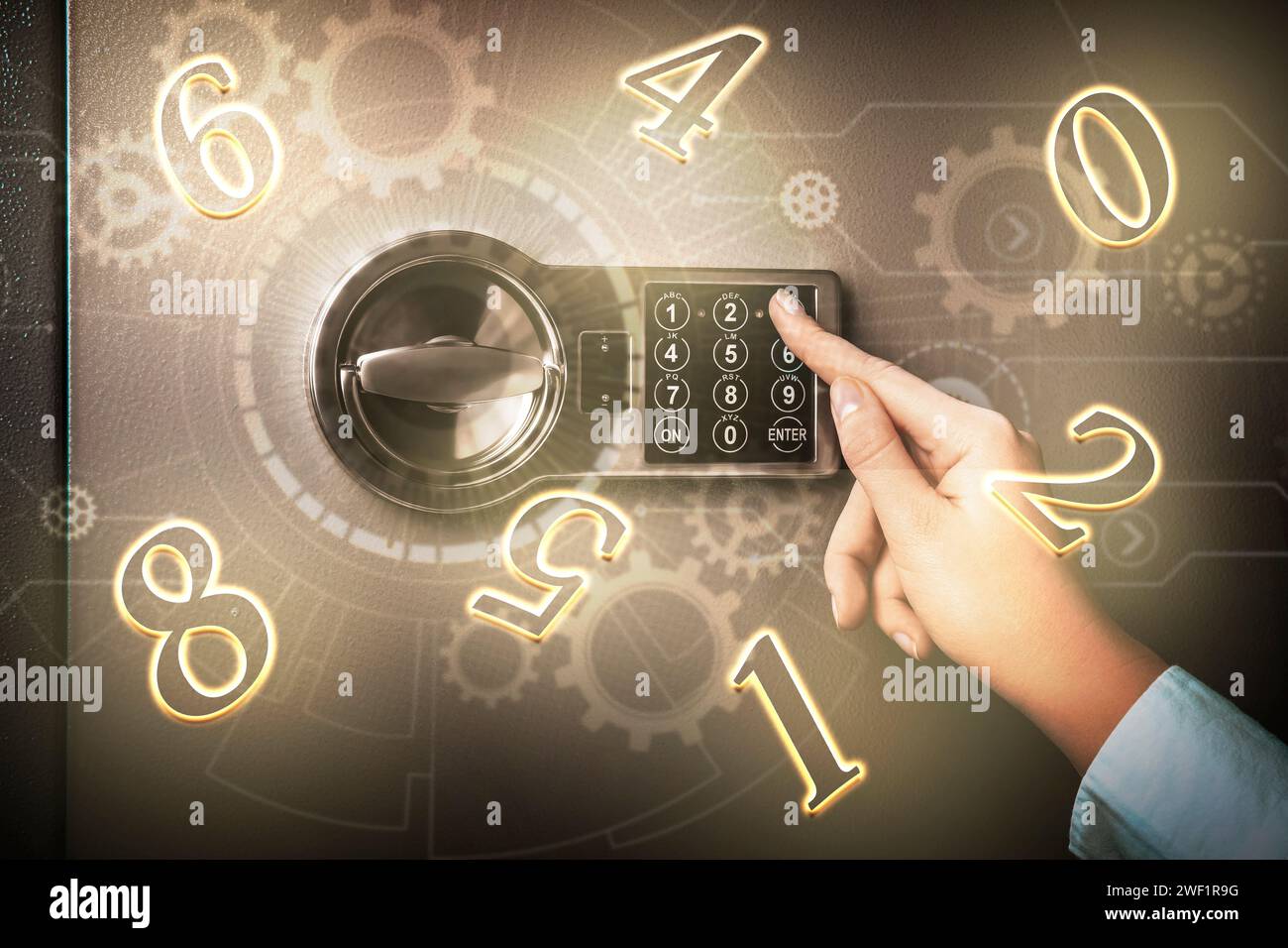 Woman pressing buttons on keypad to lock steel safe, closeup. Numbers ...