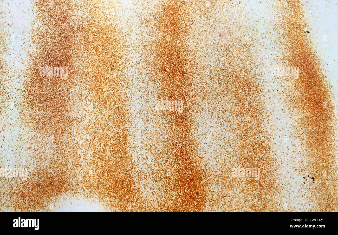 Rusted colorful painted metal wall. Rusty metal background with streaks of rust. Corroded metal background. Rust stains. The metal surface rusted spot Stock Photo