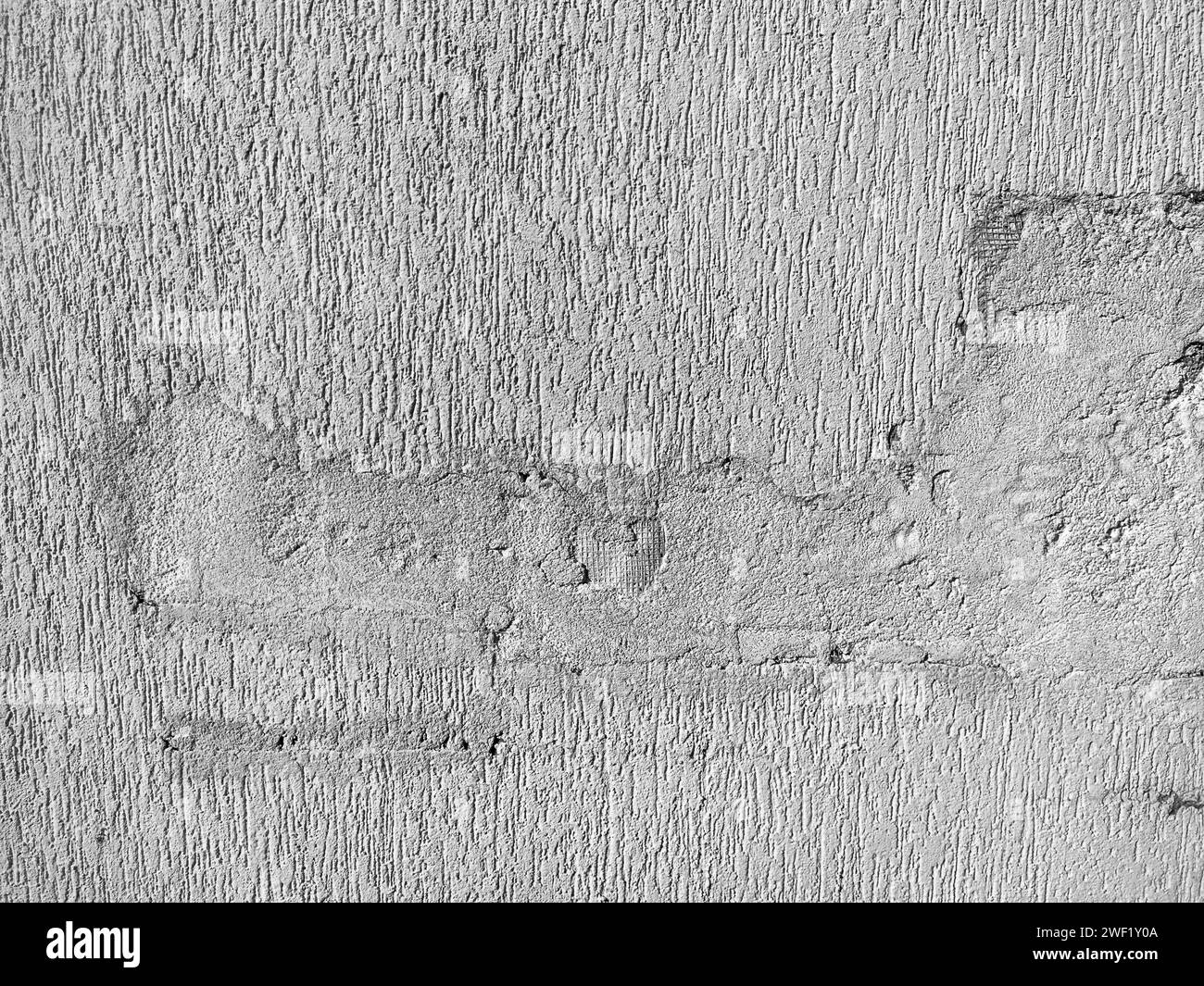 The texture of the plaster is bark beetle on the wall. Seamless grey texture. Stock Photo