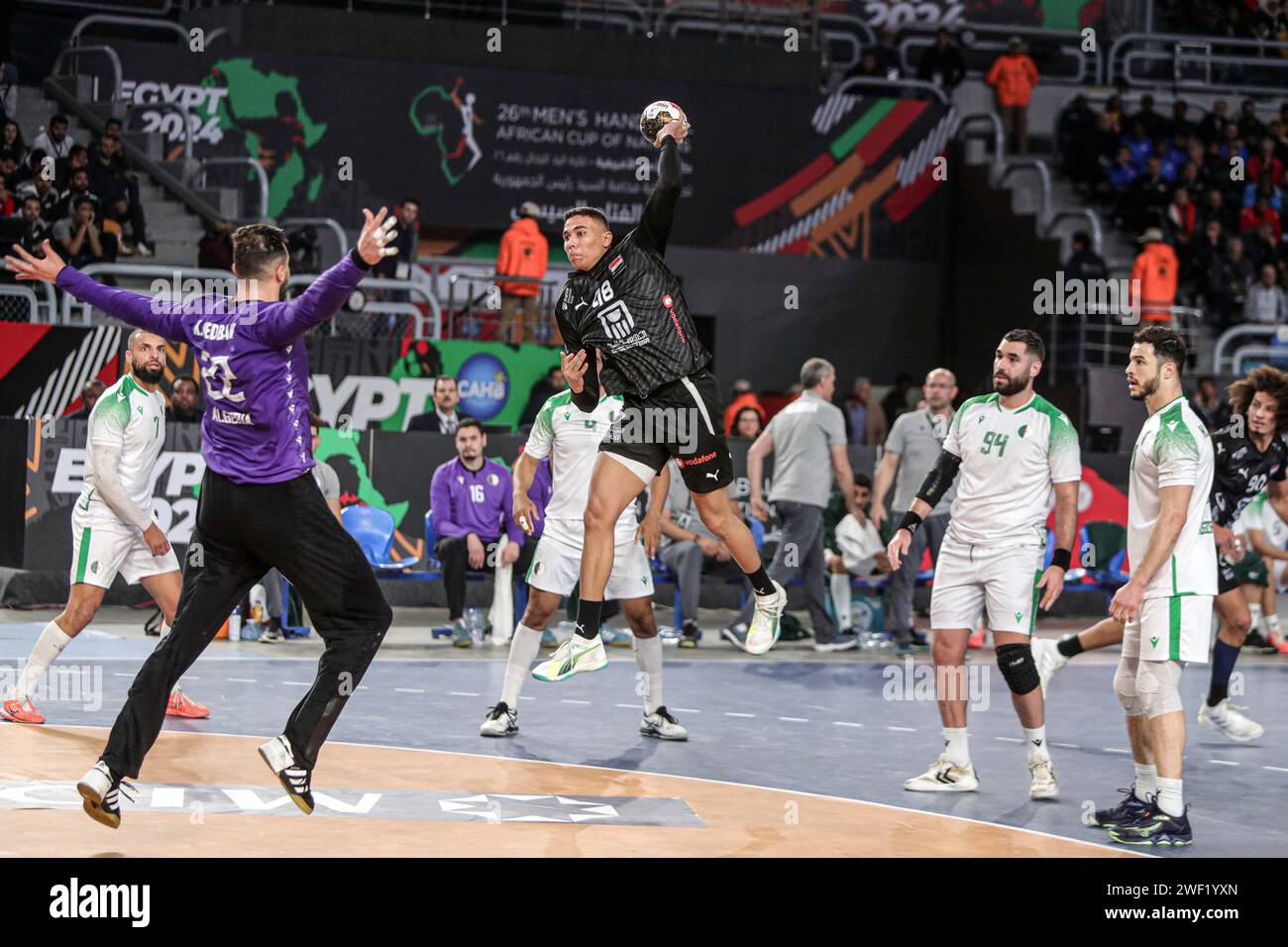 Cairo, Egypt. 27th Jan, 2024. Mohab Abdelhak (top) of Egypt shoots