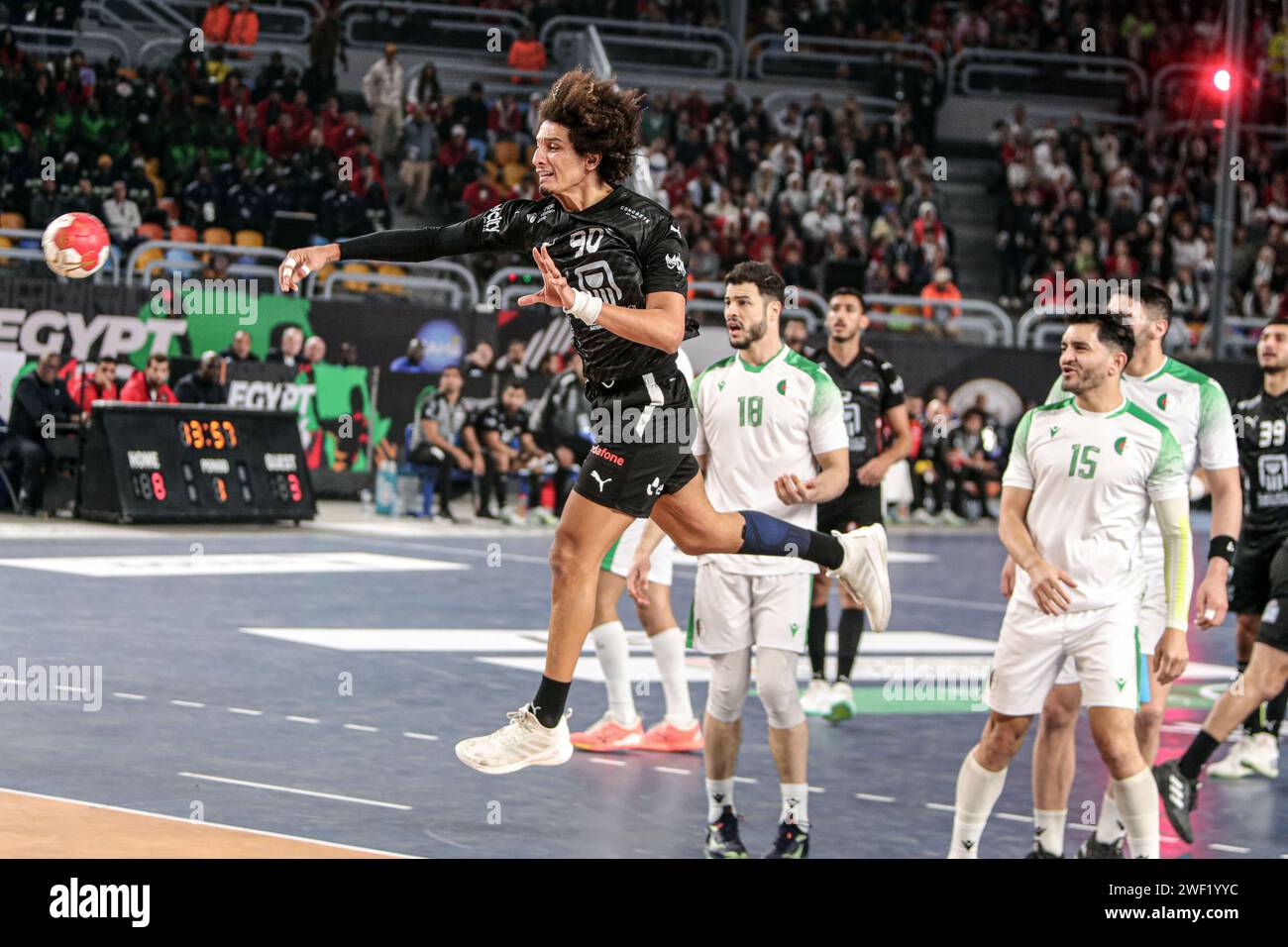 Cairo, Egypt. 27th Jan, 2024. Ali Mohamed (top) of Egypt shoots during