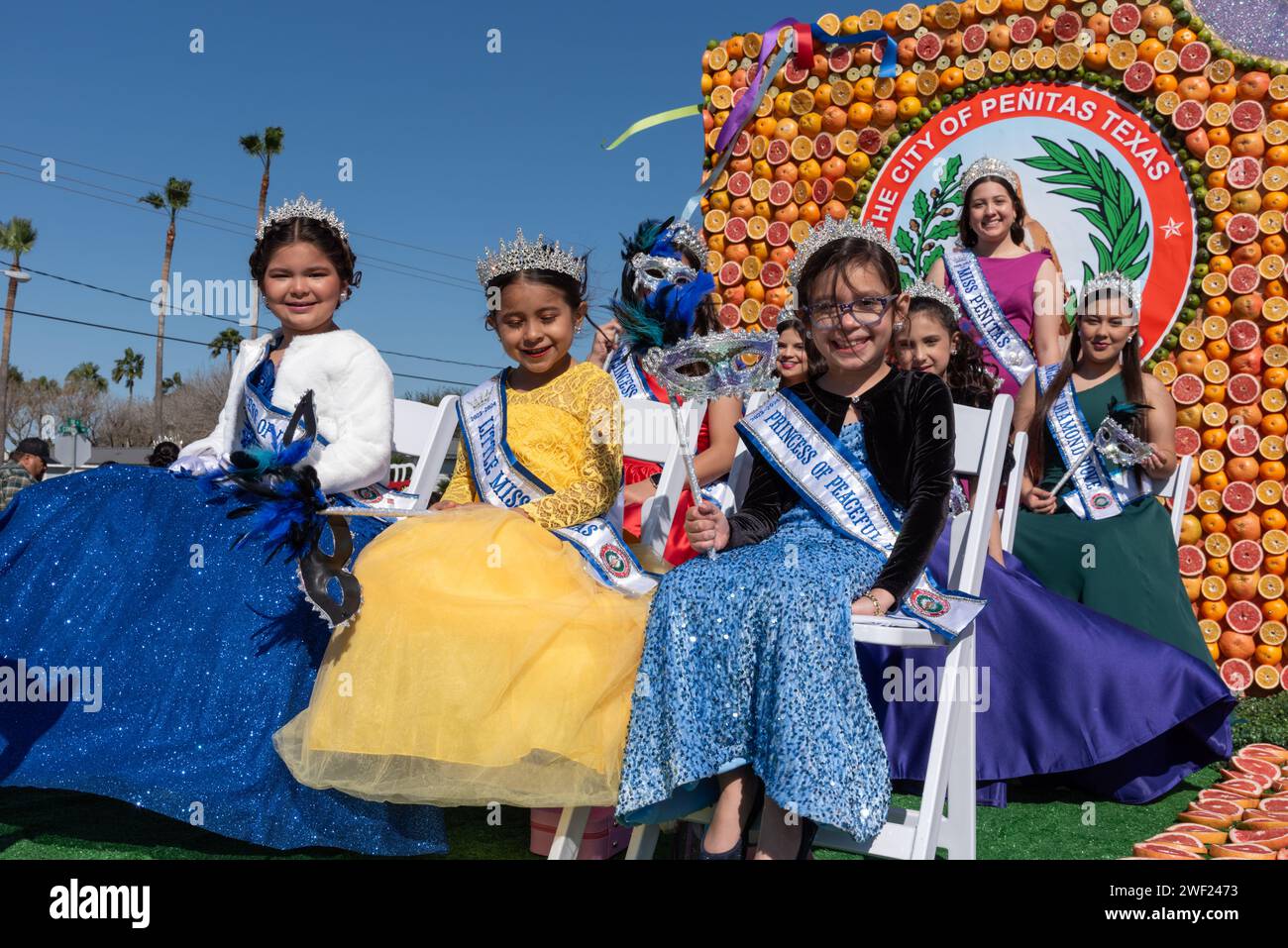 Colorful float from city of Penitas, Texas, with Miss Penitas and her court in 92nd Annual Texas Citrus Fiesta Parade of Oranges, Mission, TX, USA. Stock Photo